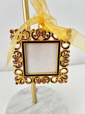 Miniature picture frame gold tone metal with red coloured stones ribbon hanger
